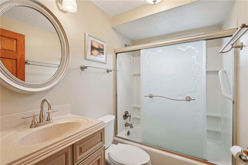 158 Maple Street Rochester, PA 15074 - Photo 21 of 37 a bathroom with a granite countertop sink toilet and a mirror