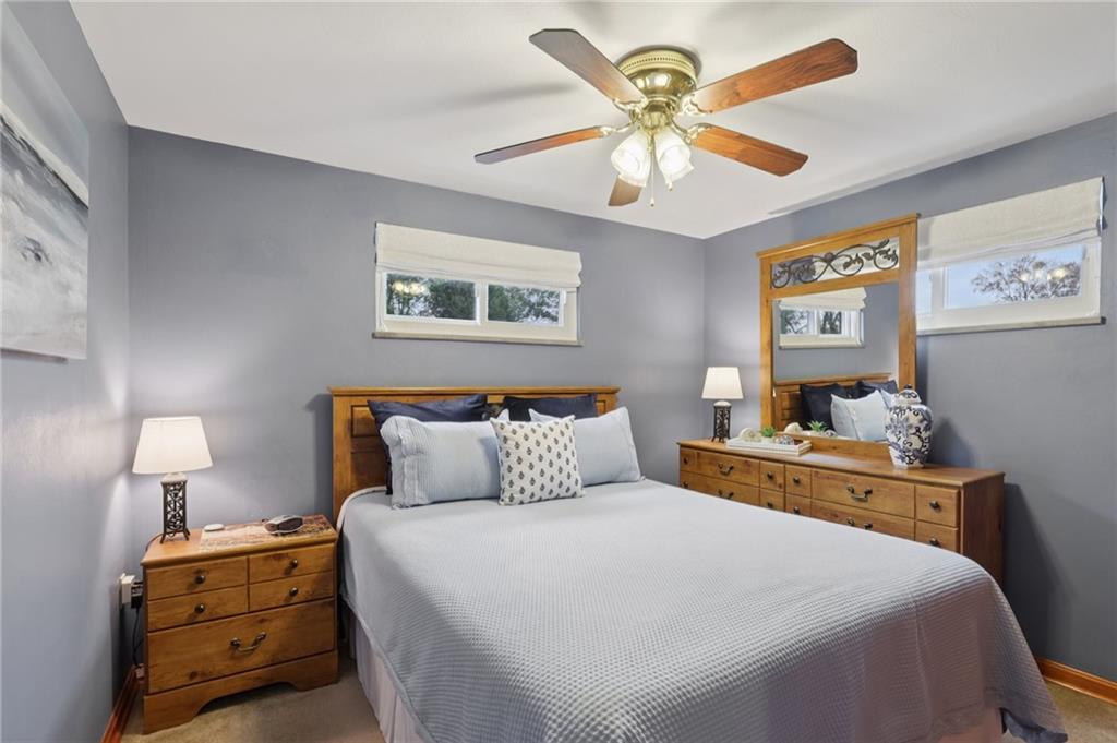 158 Maple Street Rochester, PA 15074 - Photo 23 of 37 a bedroom with a bed and a chandelier