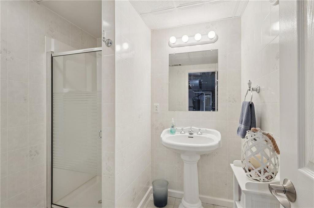 158 Maple Street Rochester, PA 15074 - Photo 26 of 37 a bathroom with a sink a mirror and vanity