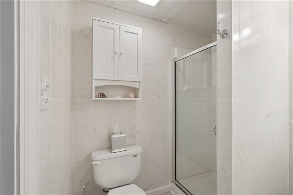 158 Maple Street Rochester, PA 15074 - Photo 27 of 37 a bathroom with a toilet a sink and mirror