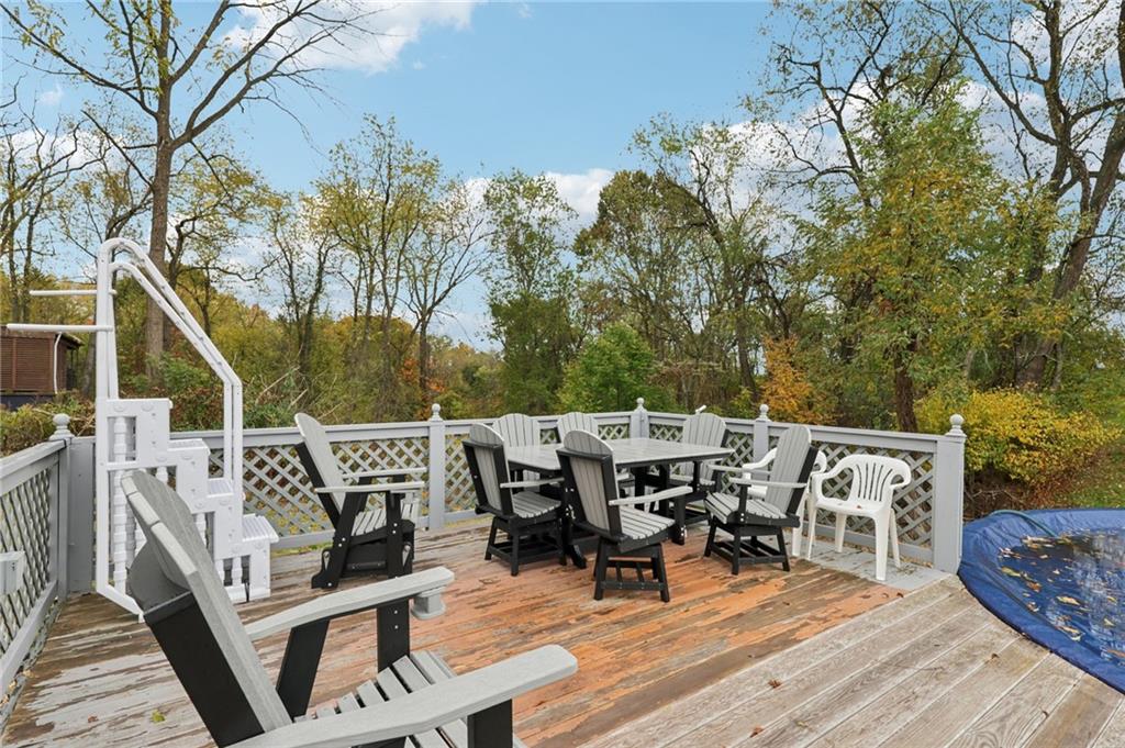 158 Maple Street Rochester, PA 15074 - Photo 30 of 37 a roof deck with table and chairs and wooden floor