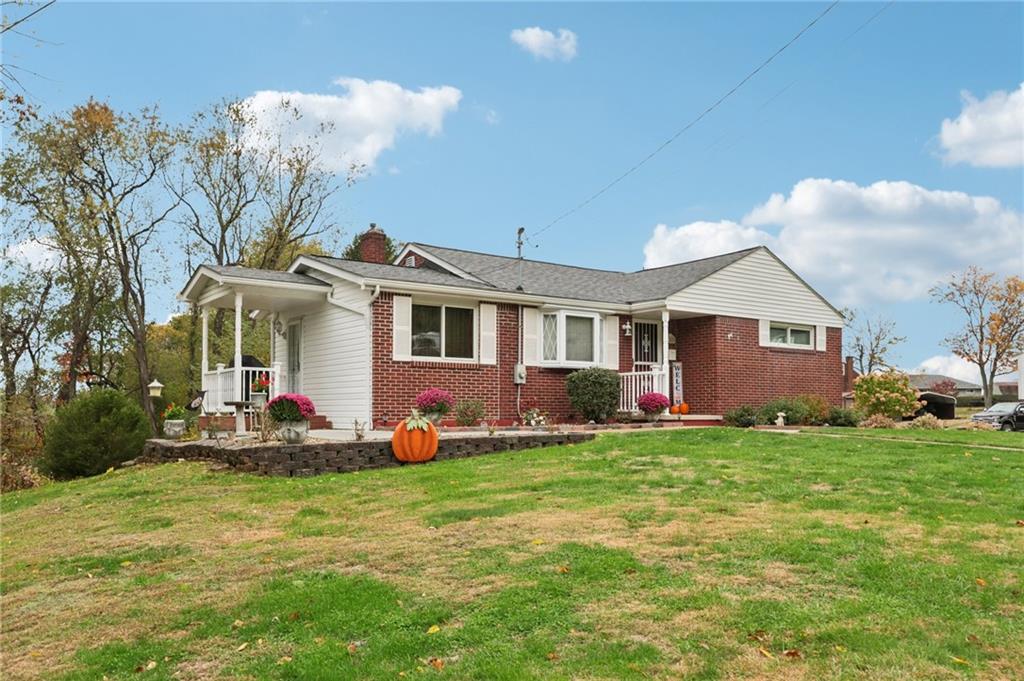 158 Maple Street Rochester, PA 15074 - Photo 3 of 37 a front view of a house with a garden