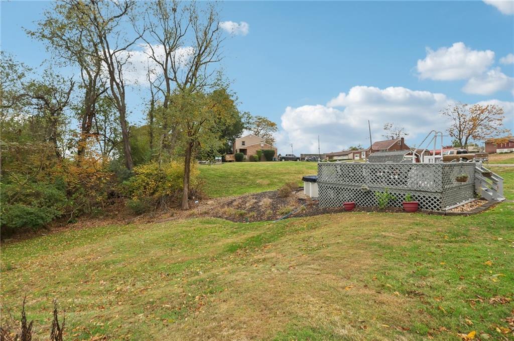 158 Maple Street Rochester, PA 15074 - Photo 36 of 37 a view of a fountain in front of house with a big yard
