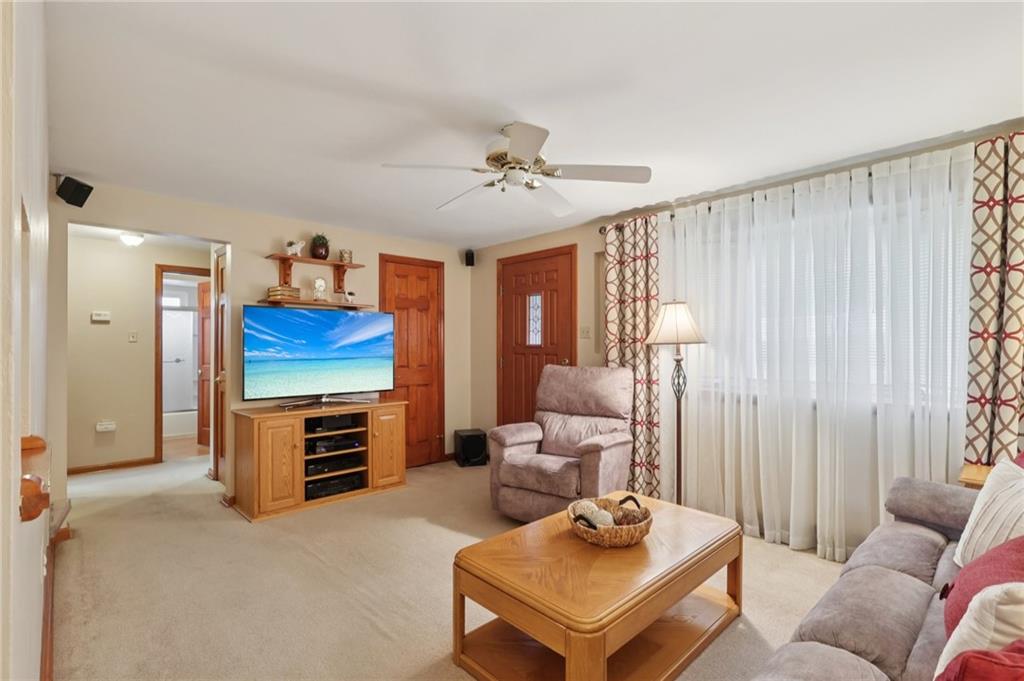 158 Maple Street Rochester, PA 15074 - Photo 7 of 37 a living room with furniture a couch and a window