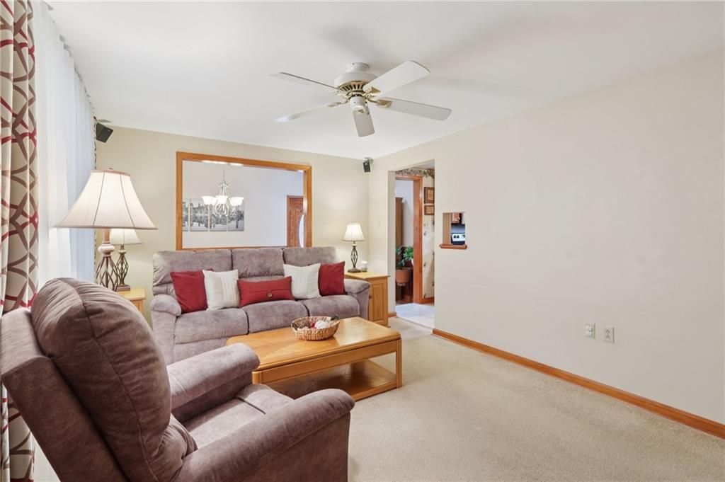 158 Maple Street Rochester, PA 15074 - Photo 9 of 37 a living room with furniture and a chandelier