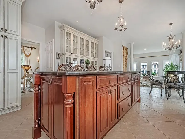a kitchen with stainless steel appliances a sink and cabinets