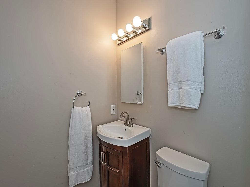 7002 Eagle Road Gibsonia, PA 15044 - Photo 38 of 49 a bathroom with a sink a toilet and mirror