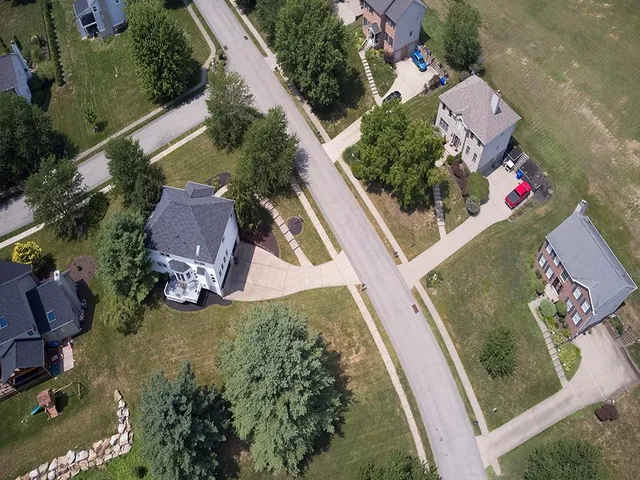 a view of a house with backyard sitting area and garden