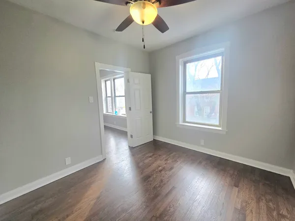a kitchen with a refrigerator sink and cabinets