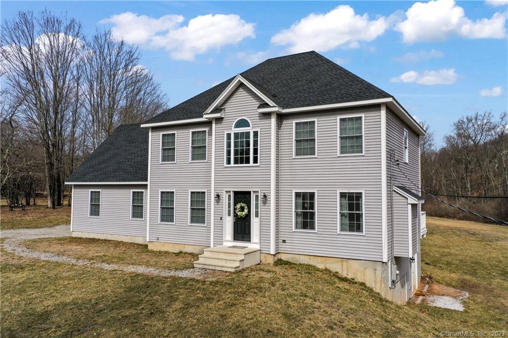 a front view of a house with a yard