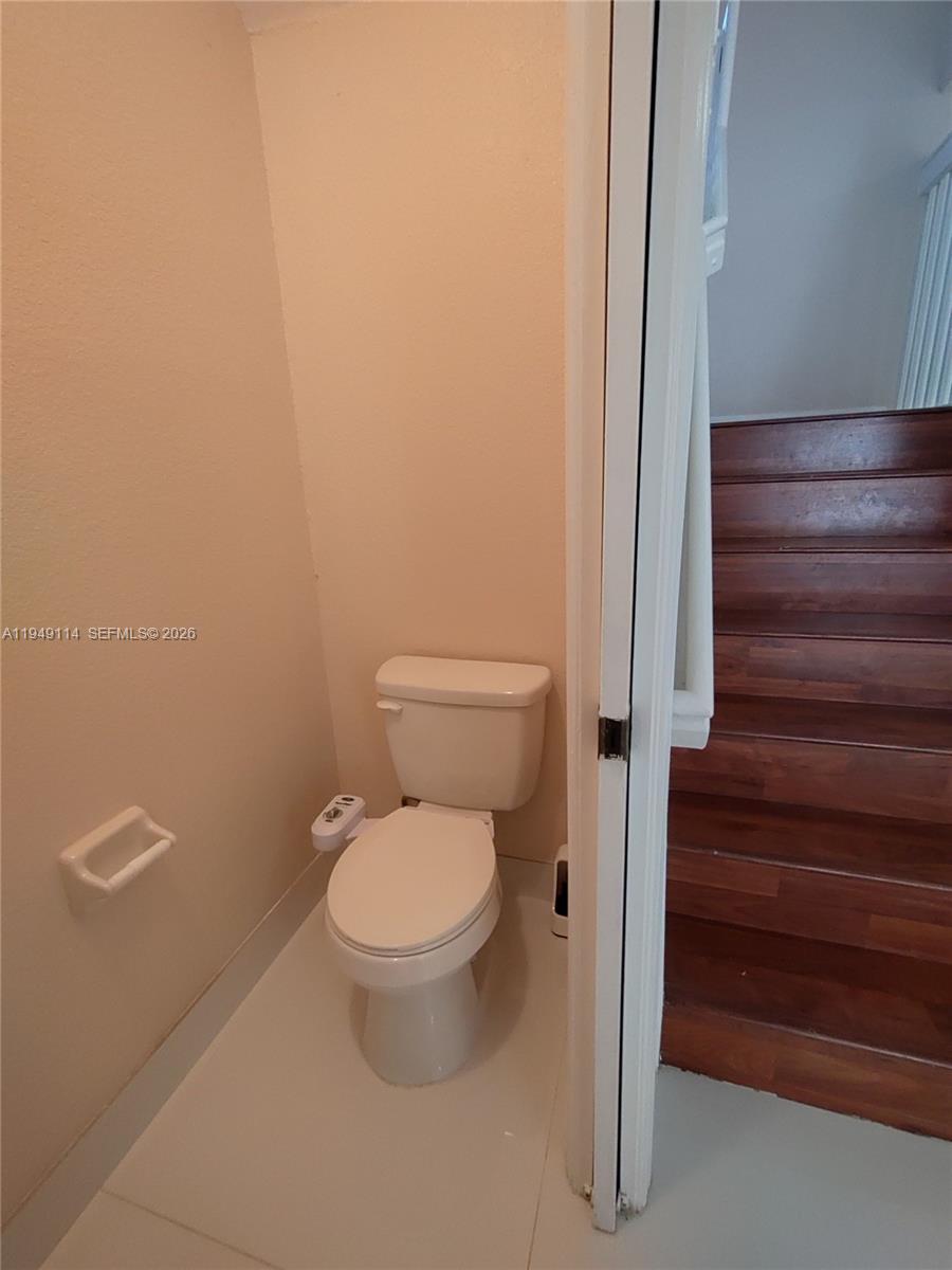 8546 Southwest 165th Place Miami, FL 33193 - Photo 15 of 40 tile floors downstairs