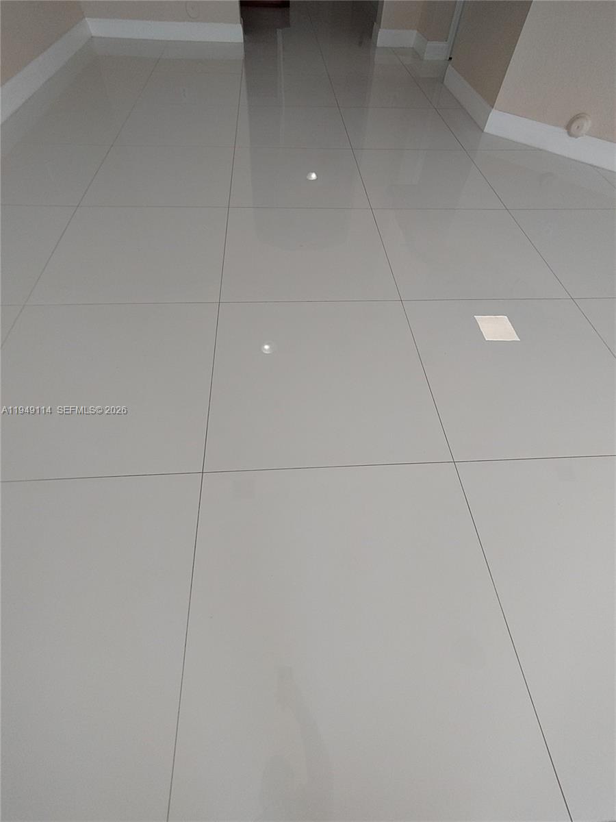 8546 Southwest 165th Place Miami, FL 33193 - Photo 40 of 40 tile floors downstairs