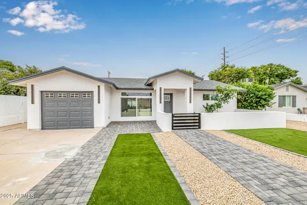 a view of house with yard and entertaining space