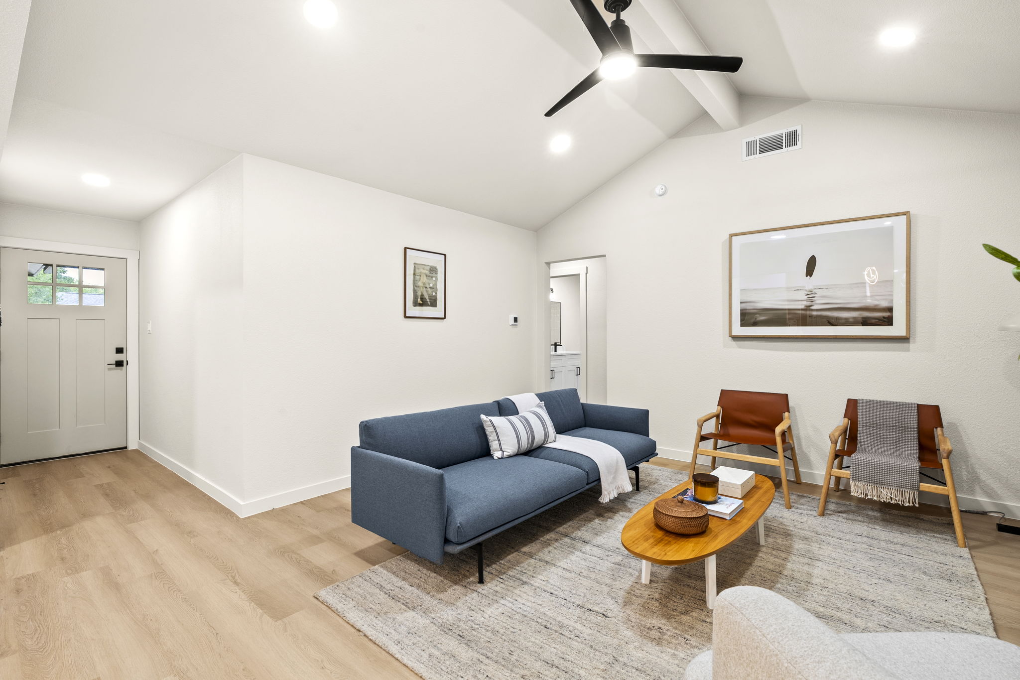 2107 Cindy Lane Austin, TX 78727 - Photo 7 of 33 Vaulted ceilings complemented by recessed lighting and a ceiling fan