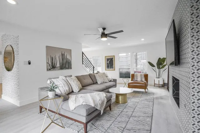 a living room with furniture and a fireplace