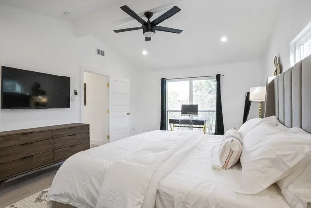 a bathroom with a double vanity sink mirror and toilet