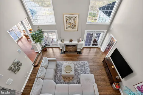 a kitchen with a dining table chairs stainless steel appliances and cabinets