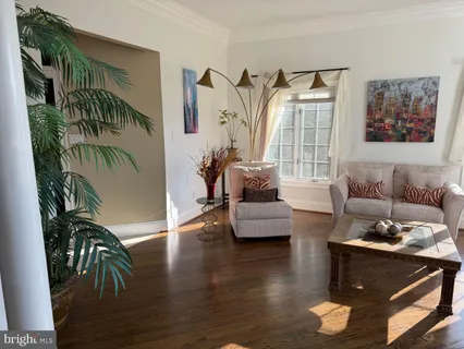 a bedroom with furniture and natural light