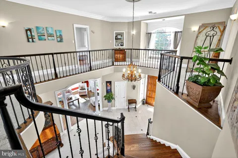 a bedroom with furniture and wooden floor