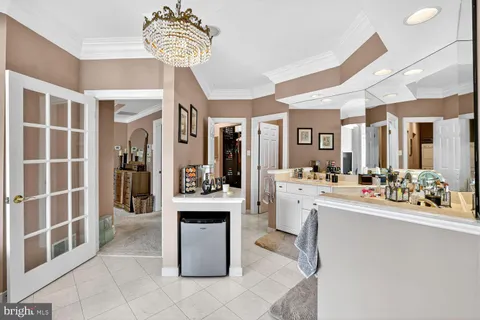 a bed room with furniture and a flat screen tv