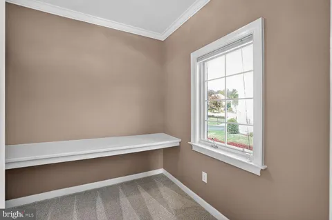 a bathroom with a sink vanity mirror and toilet
