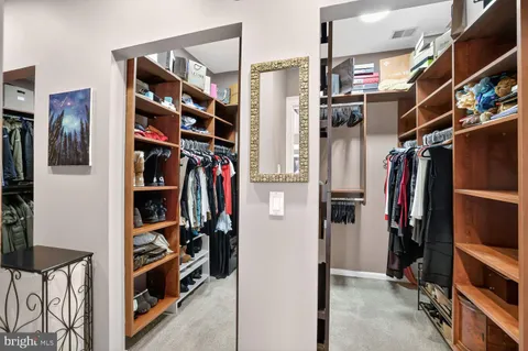 a spacious bedroom with a bed and a couch