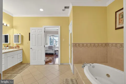 a front view of a house with swimming pool and furniture