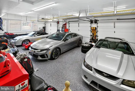 a living room with fireplace furniture and a flat screen tv