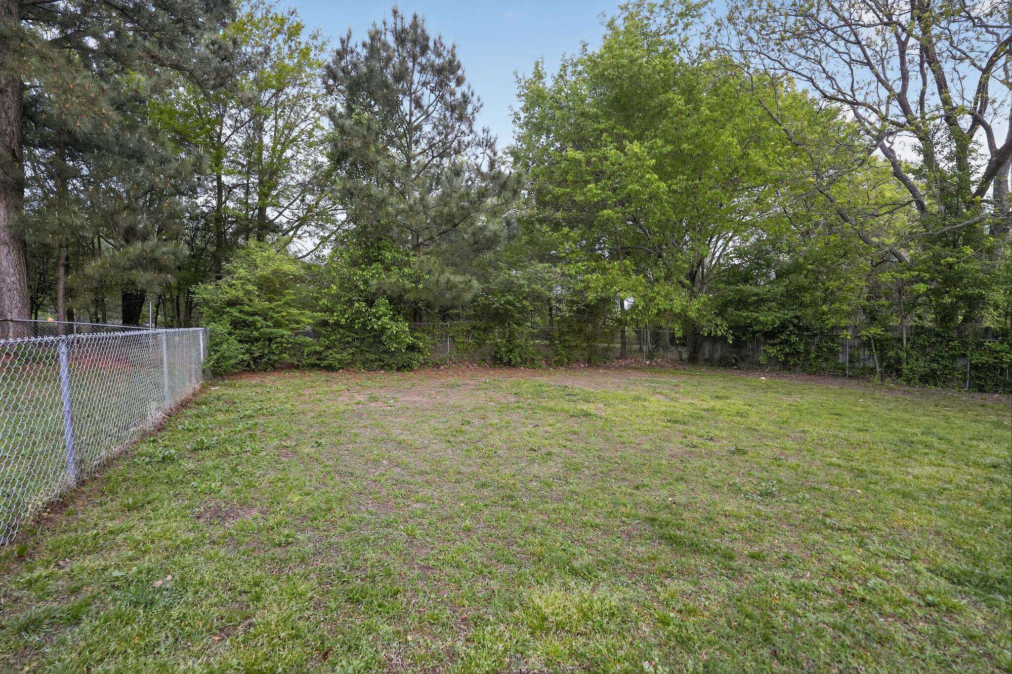 4725 Lofts Road Memphis, TN 38118 - Photo 28 of 32 Fenced backyard with view of scattered trees