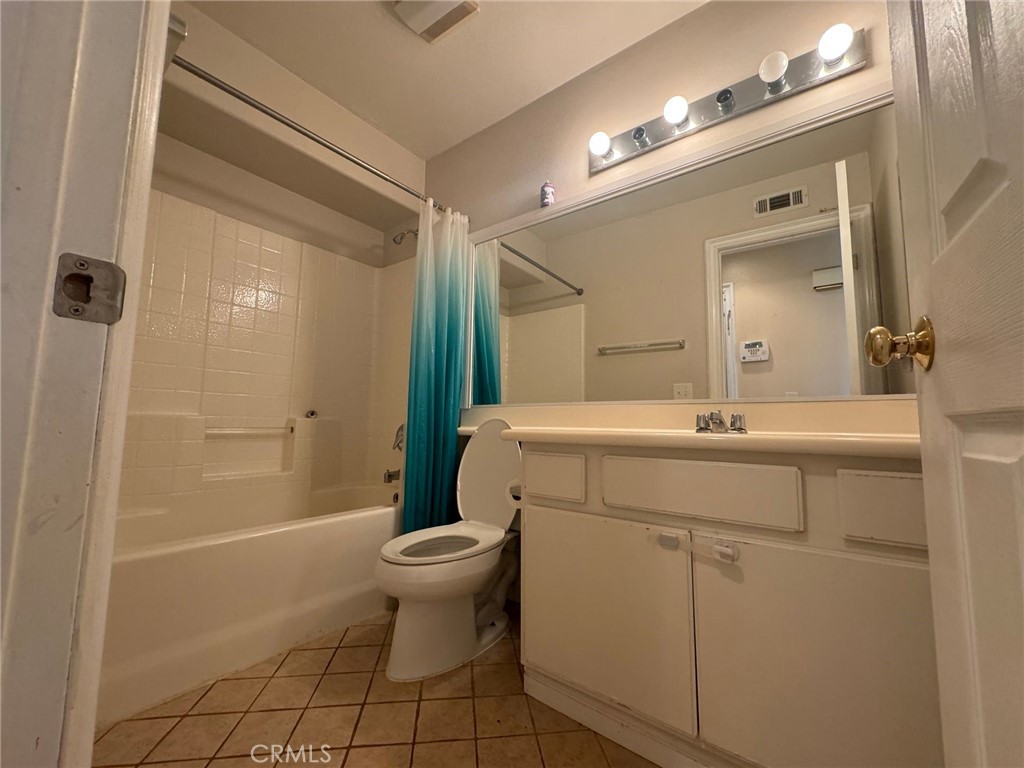 31970 Cercle Chambertin Temecula, CA 92591 - Photo 18 of 45 a bathroom with a sink toilet a mirror and shower