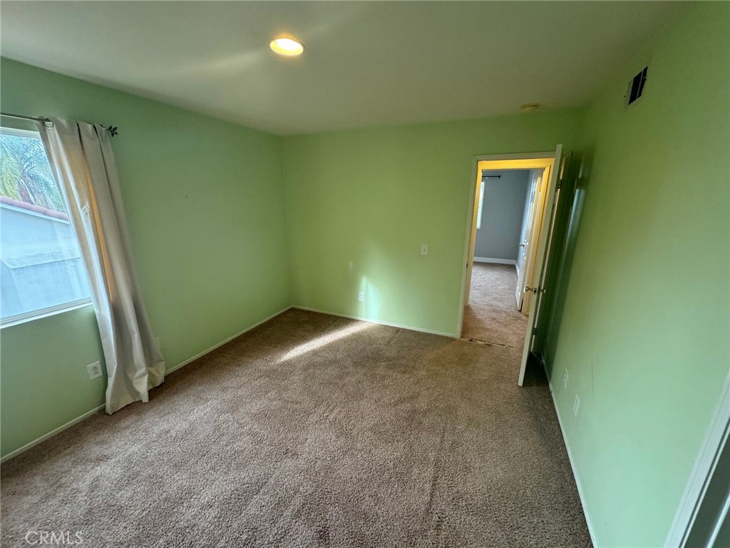 31970 Cercle Chambertin Temecula, CA 92591 - Photo 24 of 45 a view of a room with a green walls and a window