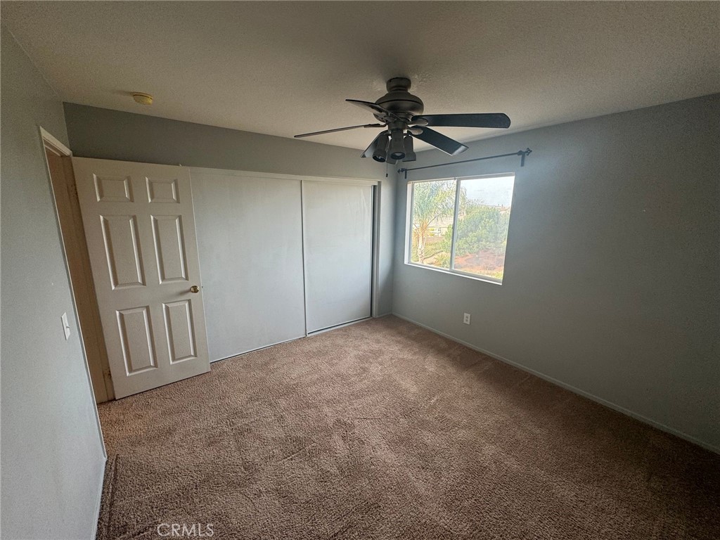 31970 Cercle Chambertin Temecula, CA 92591 - Photo 27 of 45 an empty room with windows and fan