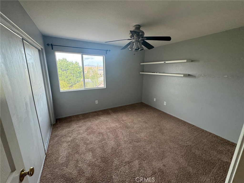 31970 Cercle Chambertin Temecula, CA 92591 - Photo 28 of 45 an empty room with a empty space and windows