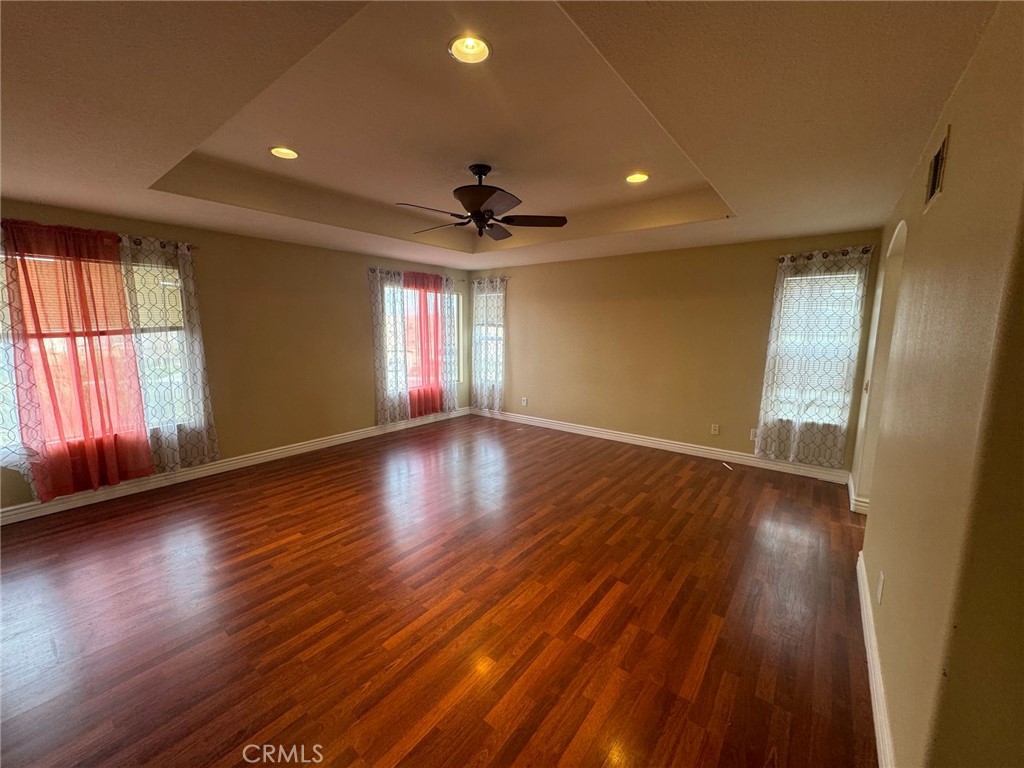 31970 Cercle Chambertin Temecula, CA 92591 - Photo 33 of 45 a view of an empty room with wooden floor and a window