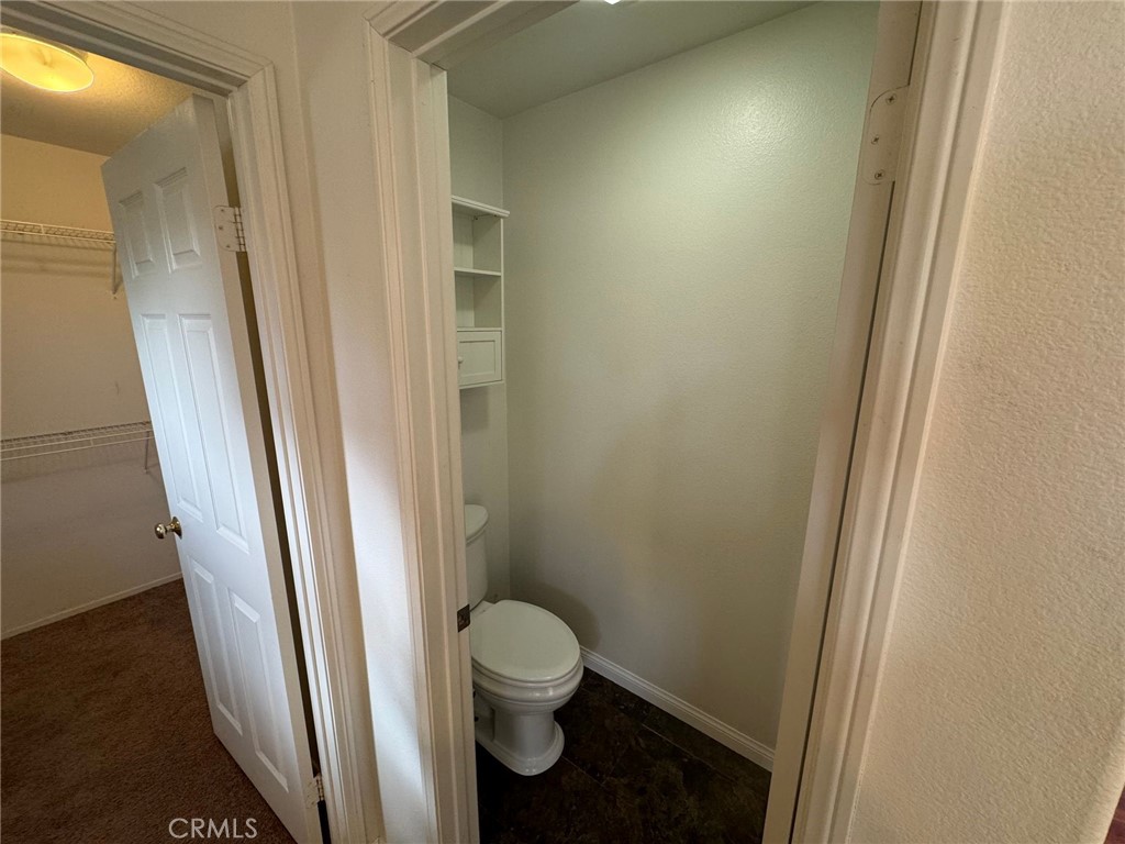 31970 Cercle Chambertin Temecula, CA 92591 - Photo 36 of 45 a bathroom with a toilet and a shower