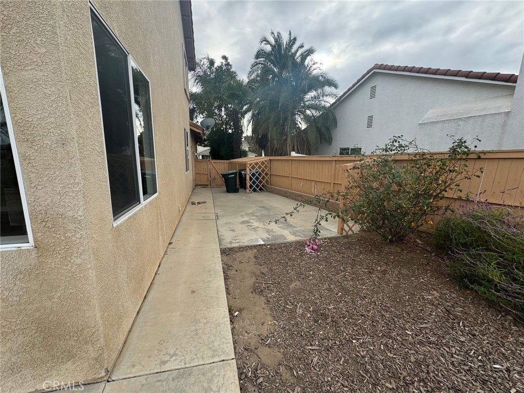 31970 Cercle Chambertin Temecula, CA 92591 - Photo 45 of 45 a backyard of a house with garage and outdoor seating