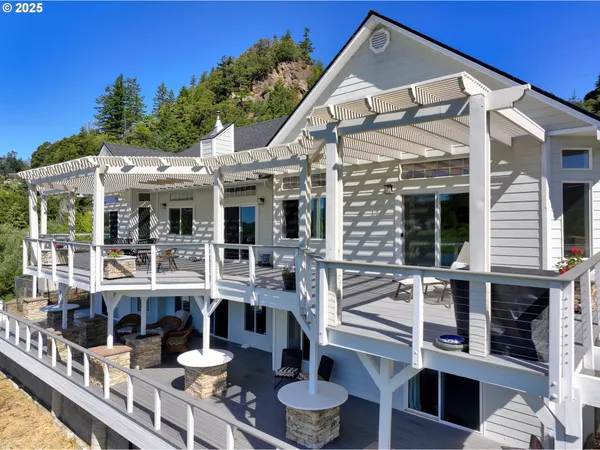 a front view of house with yard and outdoor seating
