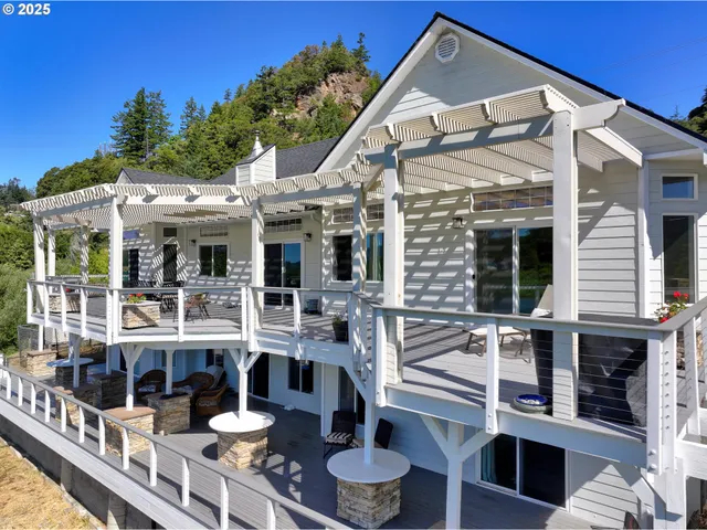 a front view of house with yard and outdoor seating