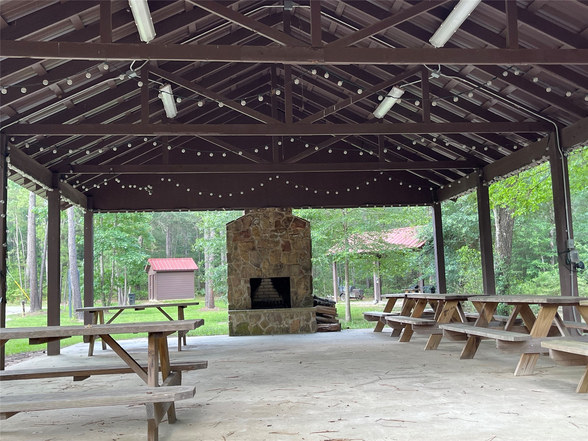 11-29-34 Grey Feather Road Huntsville, TX 77340 - Photo 18 of 26 a building outdoor space with patio furniture and potted plants