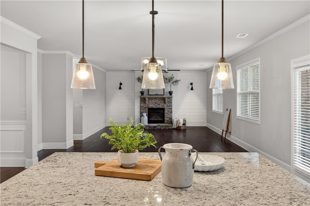 5875 Chestnut Drive Cumming, GA 30040 - Photo 23 of 55 a view of a dining room with furniture window and wooden floor