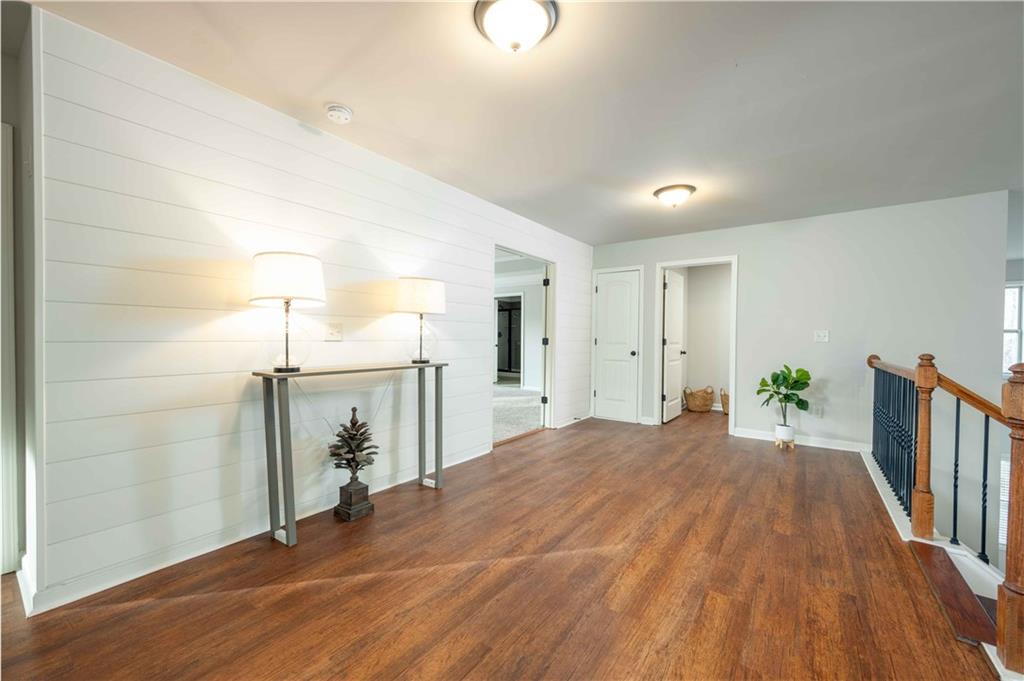5875 Chestnut Drive Cumming, GA 30040 - Photo 30 of 55 a view of a livingroom with wooden floor