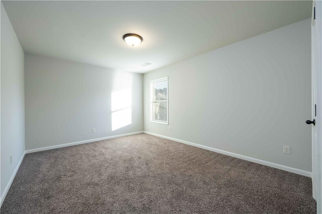 5875 Chestnut Drive Cumming, GA 30040 - Photo 41 of 55 a view of an empty room with a window
