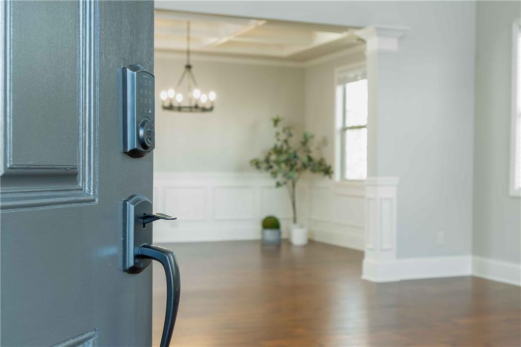 5875 Chestnut Drive Cumming, GA 30040 - Photo 9 of 55 a view of empty room with wooden floor and fan