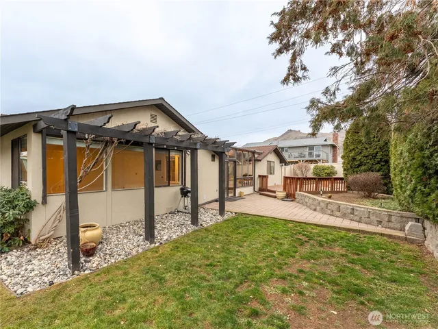 a front view of a house with a yard table and chairs