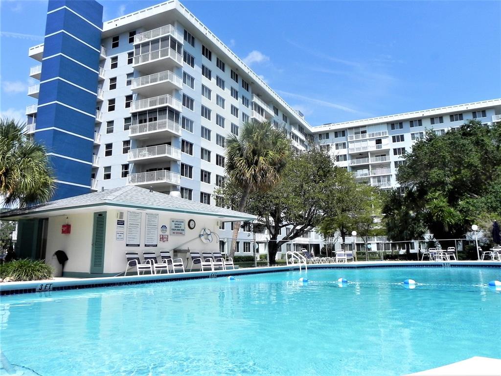 4200 Hillcrest Drive, Unit 201 Hollywood, FL 33021 - Photo 1 of 24 a view of building with swimming pool in front of it