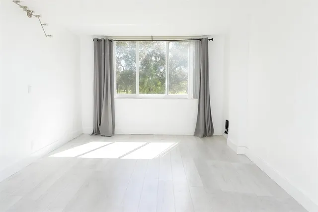 en empty room with windows