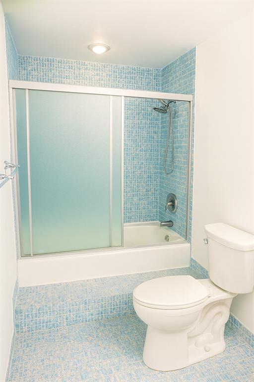 4200 Hillcrest Drive, Unit 201 Hollywood, FL 33021 - Photo 13 of 24 a bathroom with a toilet and a shower