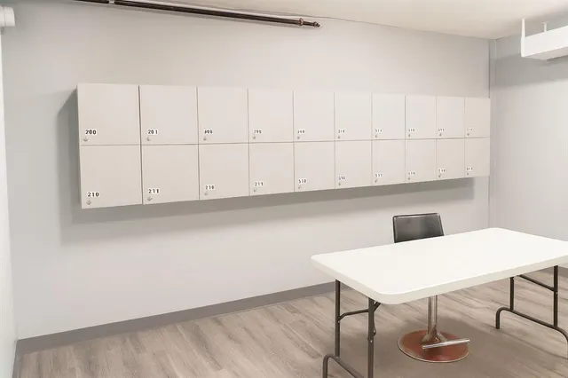 a view of an empty room and wooden floor