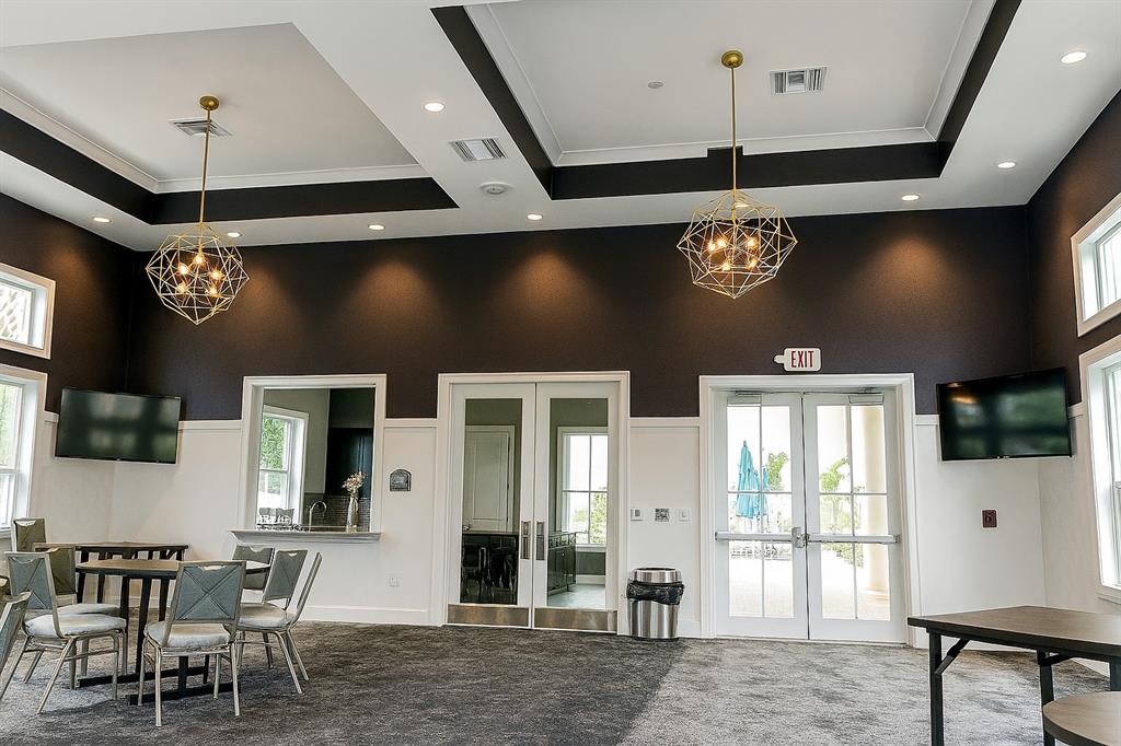 4200 Hillcrest Drive, Unit 201 Hollywood, FL 33021 - Photo 21 of 24 a view of a livingroom with furniture chandelier and windows