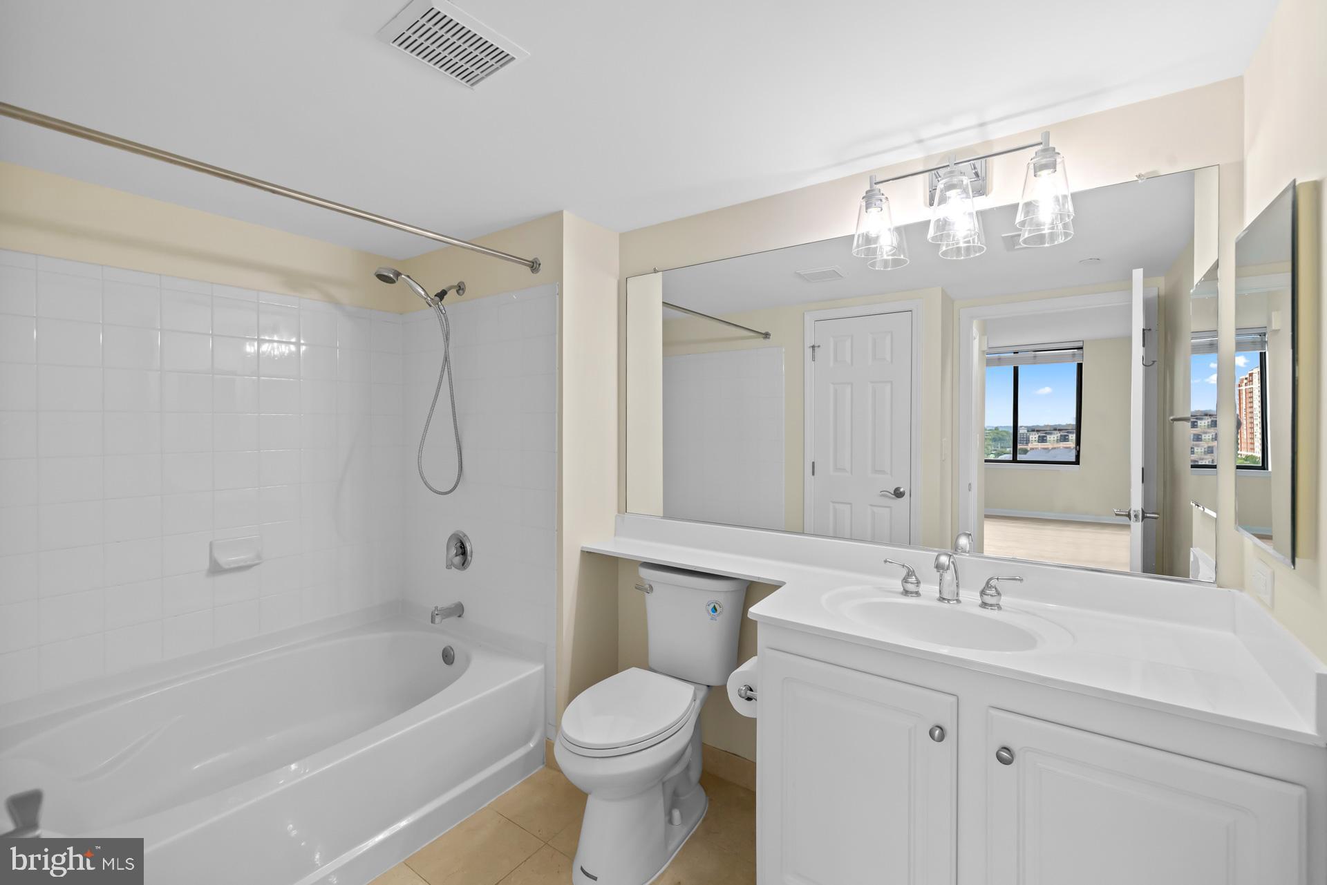 11710 Old Georgetown Road, Unit 1116W North Bethesda, MD 20852 - Photo 23 of 52 a bathroom with a sink a toilet and shower